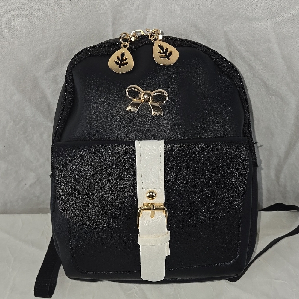 Chic Black and White Backpack with Gold Accents
